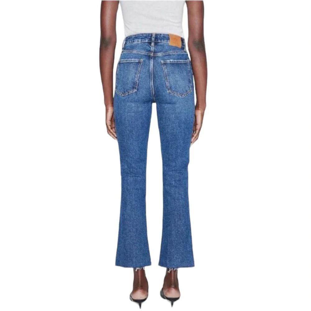 ANINE BING woman's size 31 Lara mid rise indigo raw hem ankle button fly jeans